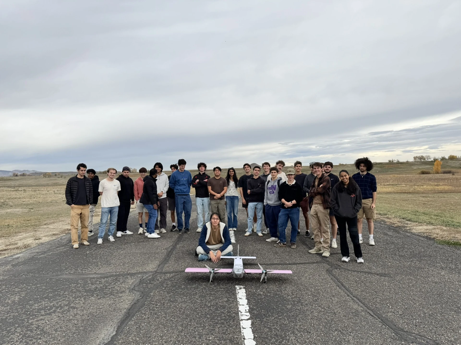 Design Build Fly team gathered with their aircraft